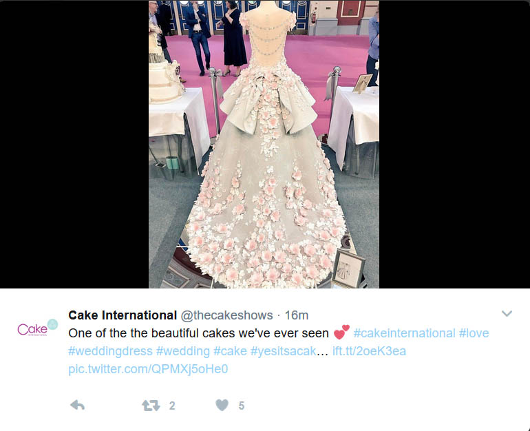 A show stopping with intriguing imagination life-size cake bride in a cake wedding gown at the Cake International show Alexandra palace, London April 2017